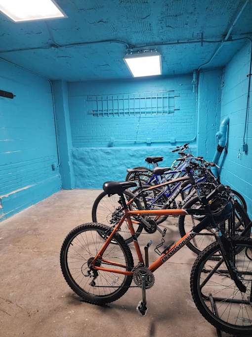 A bicycle is parked in a garage.