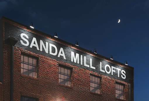 A building with the words "SANDA MILL LOFTS" on it.