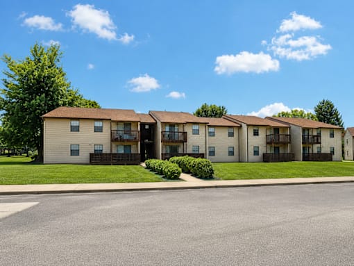 Apartment complex with a clear blue sky above.