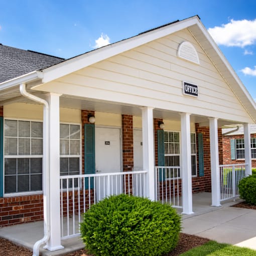 A small white building with a sign that says "OFFICE" on the front.