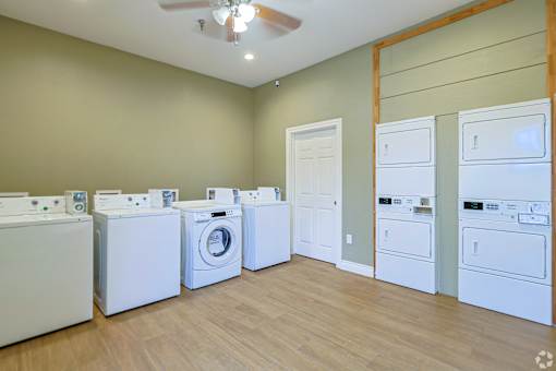 A laundry room with a washer and dryer in it.