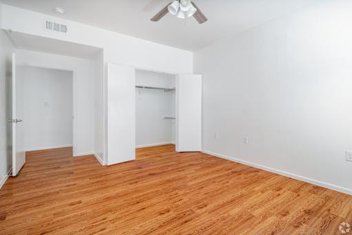 A room with wooden floors and white walls.