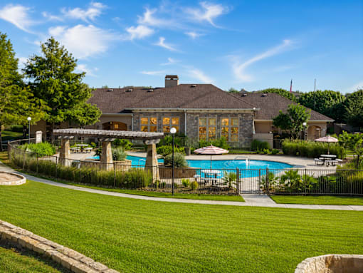 A large house with a pool in the backyard.