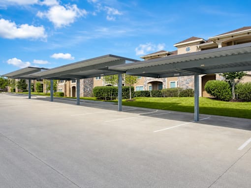 A parking lot with a building in the background.