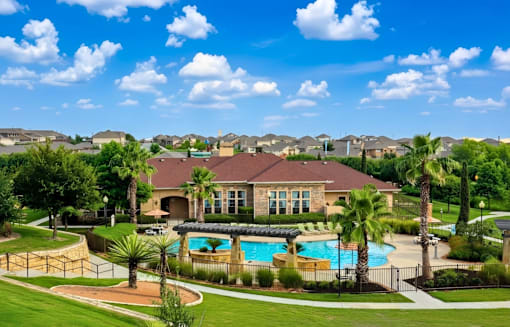 A large house with a pool in the backyard.