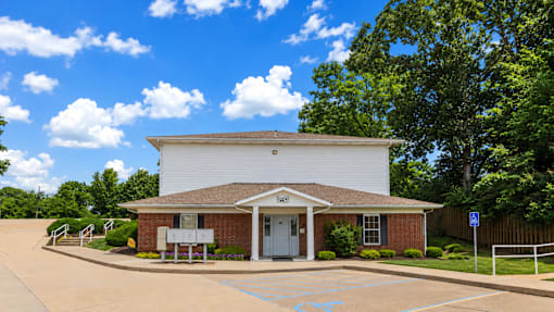 A small white building with a sign that says "Light" on it.