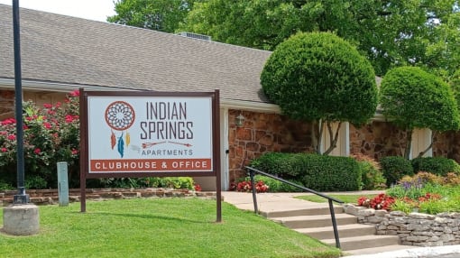 a building with a sign that says indian springs apartments