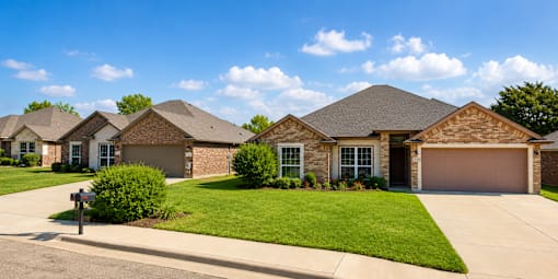 A row of houses with a mailbox in front.