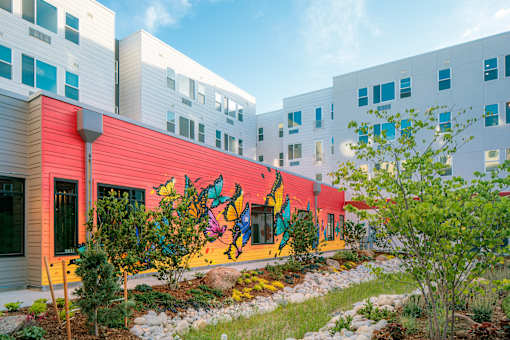 A colorful mural on a building's side.