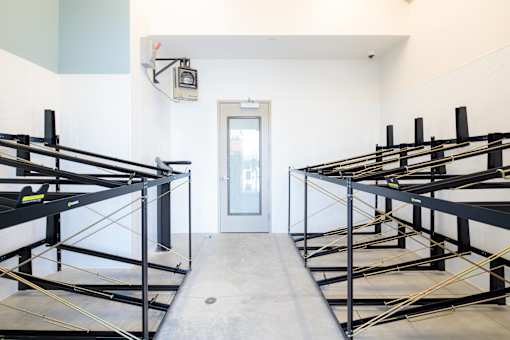 A room with bunk beds and a door.