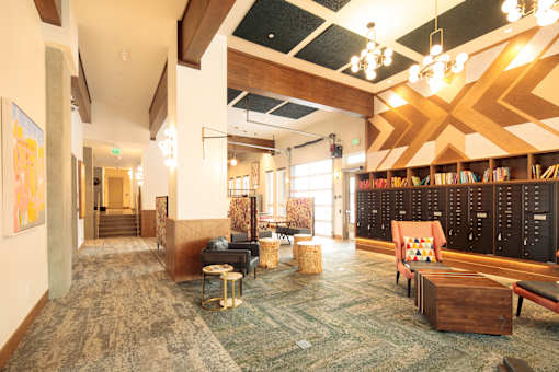 A room with a carpeted floor and a wooden ceiling.