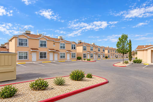A large building with a parking lot in front of it.