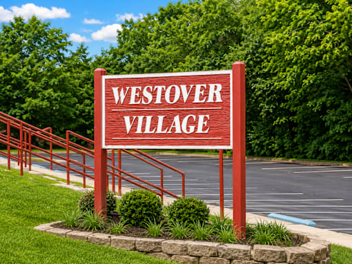 A red sign that says Westover Village in white letters.