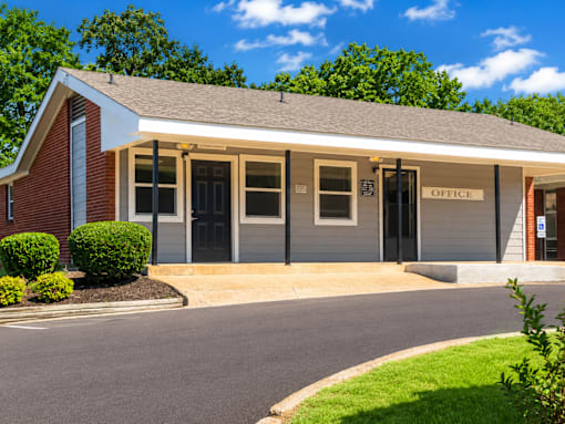 A small building with a sign that says "OFFICE" on the front.