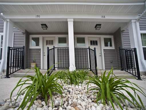 A house numbered 190 is shown with a front yard and a black fence.