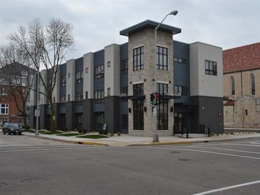 A street view of a building with the name Daniel on it.
