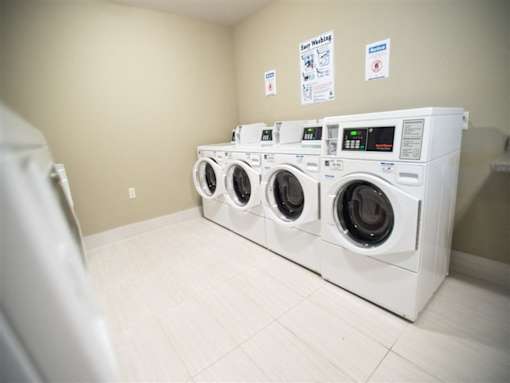 A row of washing machines in a laundromat.