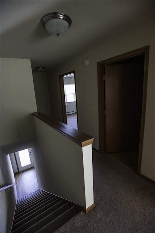 A small room with a window and a door.