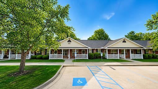A building with a parking lot in front of it.