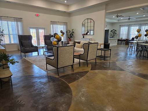A living room with a circular floor and a fireplace.