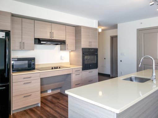 a kitchen with a large counter top and a sink