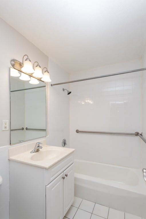 Quincy commons one bedroom bathroom with bright white clean finishes