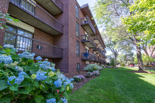 Quincy Commons apartments with beautiful landscaping and flowers along each building