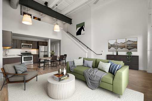 A living room with a green couch and a coffee table.