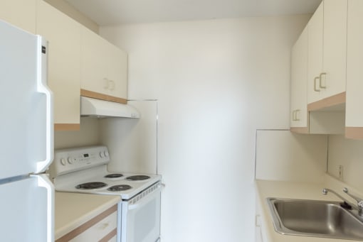 babcock tower apartment kitchen with range oven and fridge