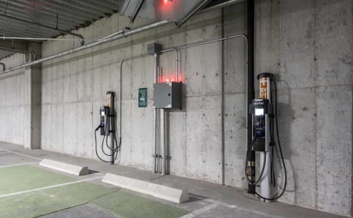 a row of gas pumps in a parking garage