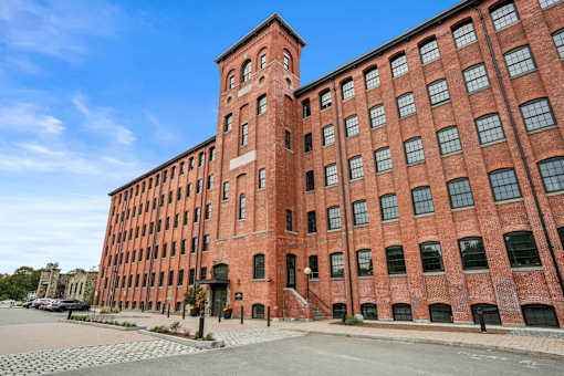 A large red brick building with a clock tower.