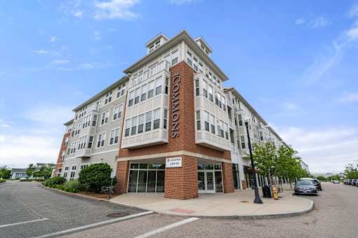 A multi-story building with a sign that reads "GARDEN".