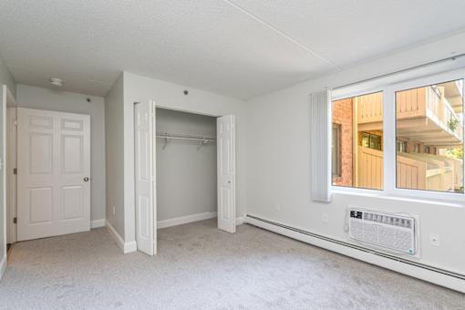 Kimball court renovated apartment bedroom with window and extra sunlight