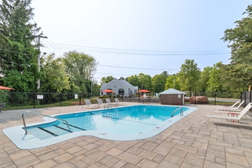 Outdoor swimming pool at Mansfield Meadows Apartments in Mansfield, MA.