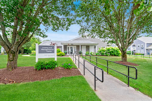 the preserve at ballantyne commons community entrance with trees and a fence at Blue Hills Village, Canton, MA