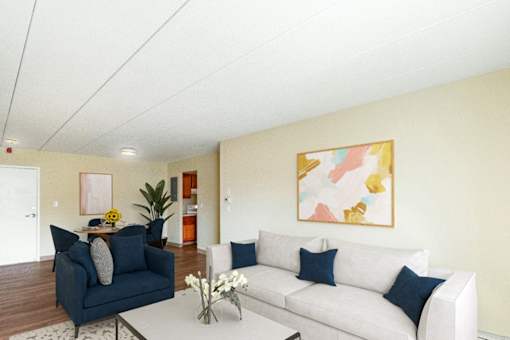 A living room with a blue couch and a white couch at Edmands House, Massachusetts, 01701
