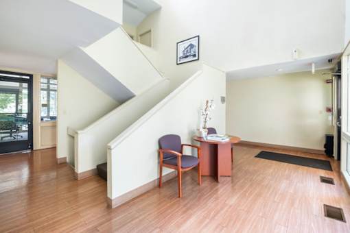 Entryway with staircase and reception desk at Blue Ridge Estates Apartments, Virginia
