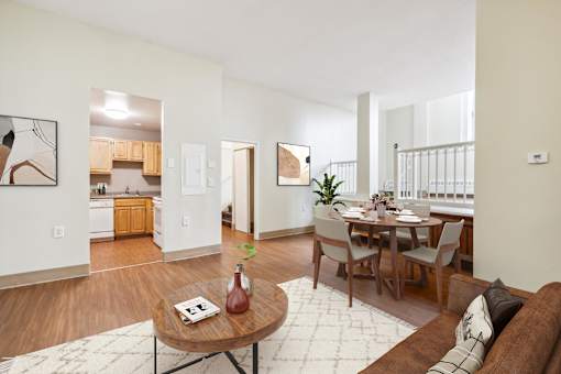 an open living room with a dining room table and a kitchen at Chapman House, E. Boston, Massachusetts, 02128