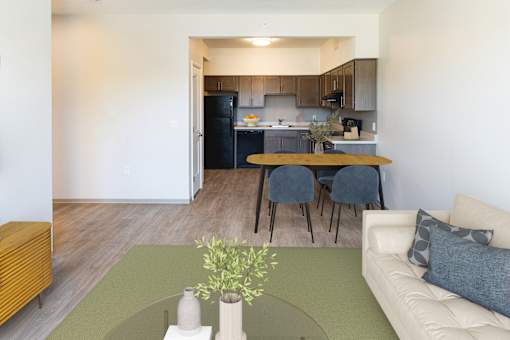 A modern living room with a dining area in the background  at 35 Broadway Apartments, Menands, New York