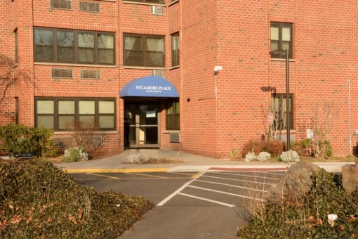 Entrance Way And Parking Lot Sycamore Place Apartments.