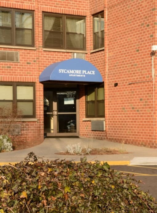 Entrance Way And Parking Lot Sycamore Place Apartments.
