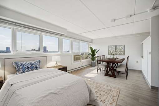 Studio apartment with dining area and city views at Baystate Place Apartments, Springfield, MA 1104