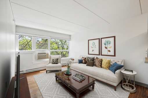 Bright living room with comfortable seating at Baystate Place Apartments, Springfield