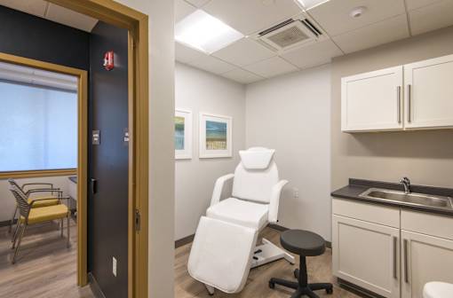 Medical treatment room with examination chair at Baystate Place Apartments, Springfield, 1104