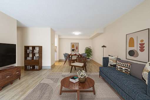 a living room and dining room with a couch and a table at Blue Hills Village, Canton, 02021