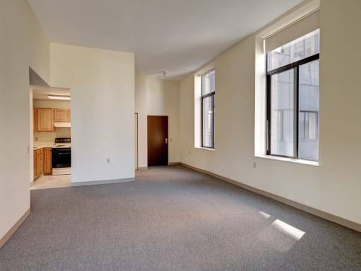 Living Room and Kitchen  at Robinson Cuticura Mill Apartments in Malden , MA.