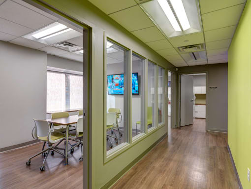 Management Office with Conference Room Seating and TV. at Mandela Homes, Boston, Massachusetts