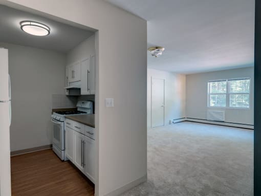 Kitchen and Living Room at Wilkins Glen Apartments in Medfield, MA.