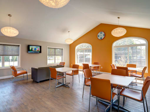 Community clubroom with TV at Mansfield Meadows Apartments in Mansfield, MA