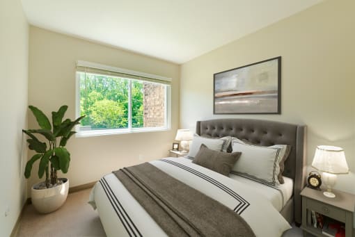 Bedroom with Carpet and Large Window.